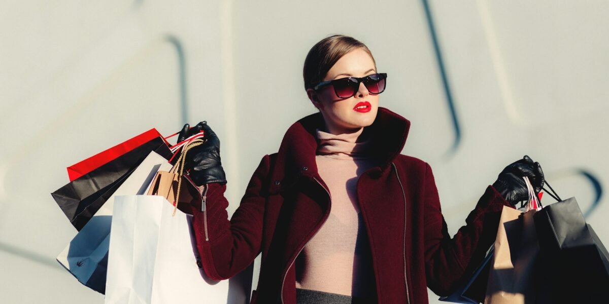 Woman in a tailored camel coat shopping in the city